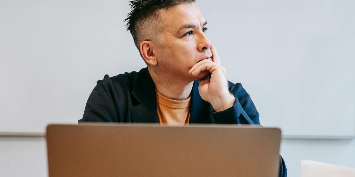 A person deeply focused, symbolizing the effort to process information and make strategic decisions.