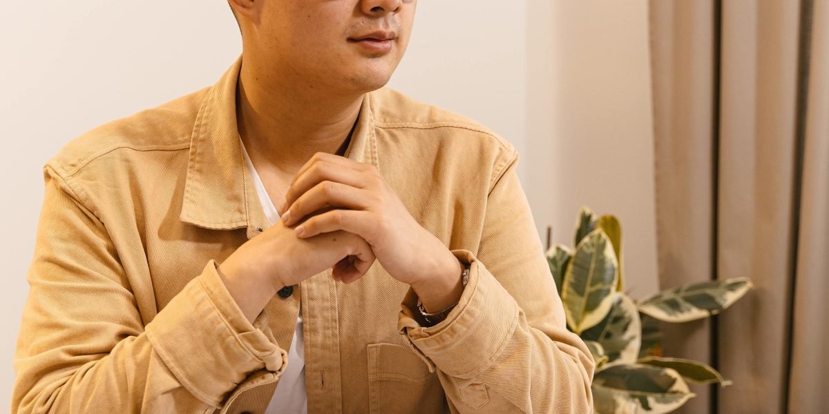 A person deeply engaged in thought, symbolizing the challenge of discerning true AI advancements from mere hype in the photography industry.