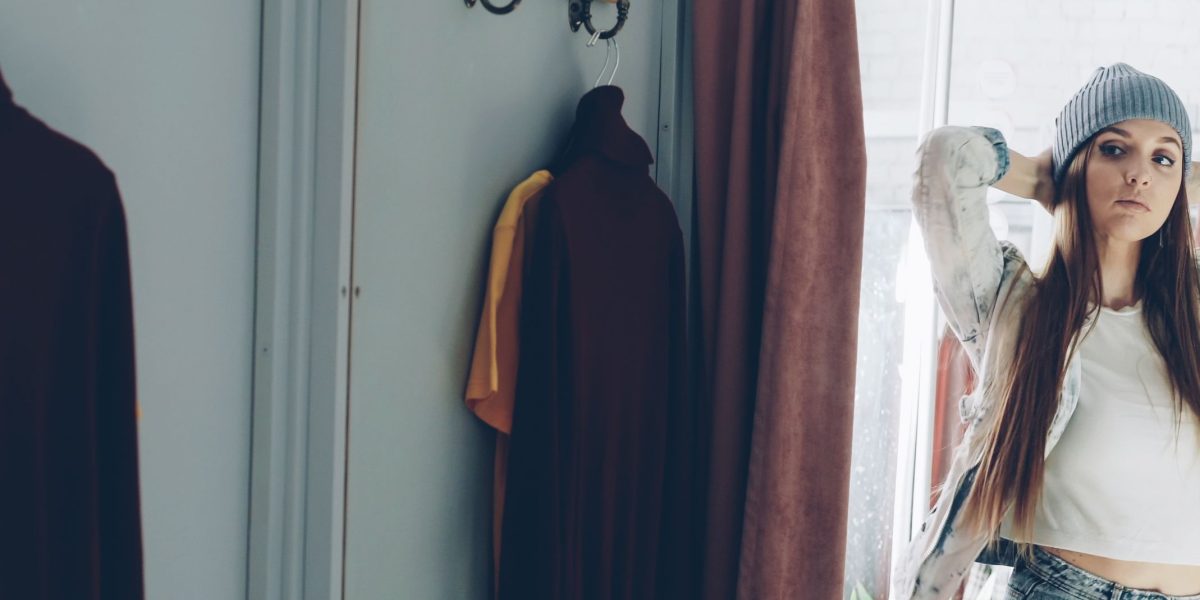 A person experiencing a virtual try-on, visualizing garments on their body before making a purchase.