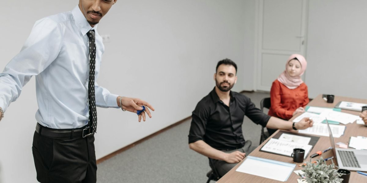 A confident person presenting a project to a group, emphasizing the importance of communication skills for career advancement.