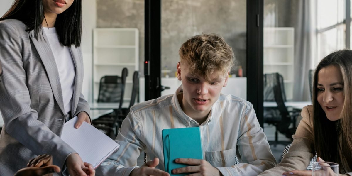 Professionals collaborating effectively in a modern workplace setting, symbolizing human-AI synergy.