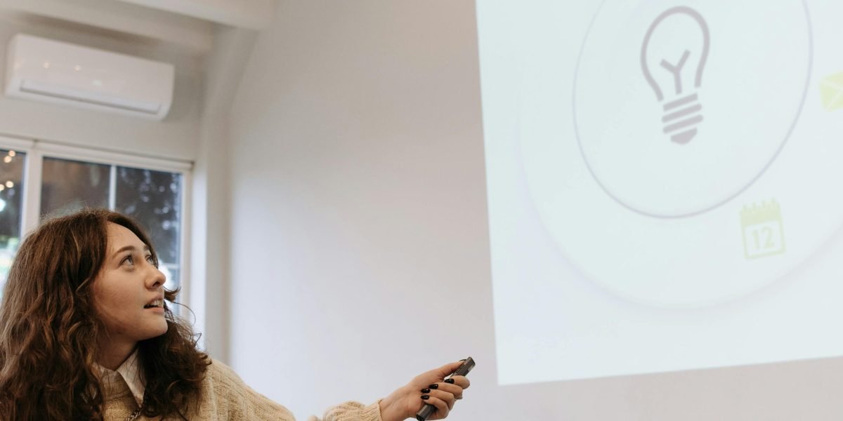A team leader presenting strategic insights to a group in a modern office setting.
