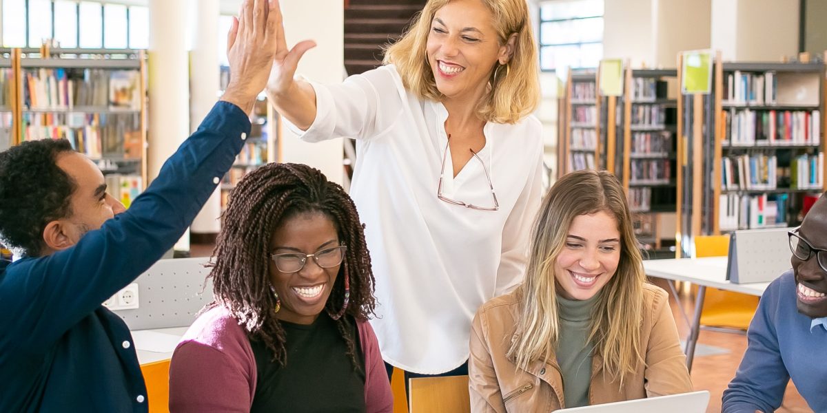 University students collaborating on a project in a study space, reflecting global AI education.