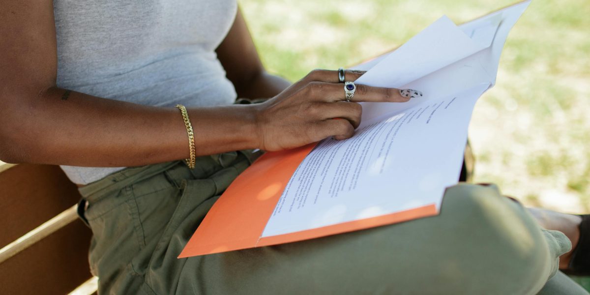 A person meticulously reviewing documents, symbolizing the careful evaluation needed for AI platform selection.