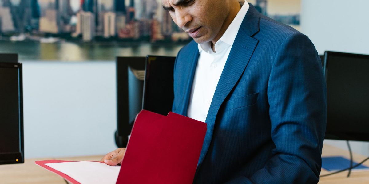 An individual deeply focused on understanding complex documents, benefiting from intelligent assistance.