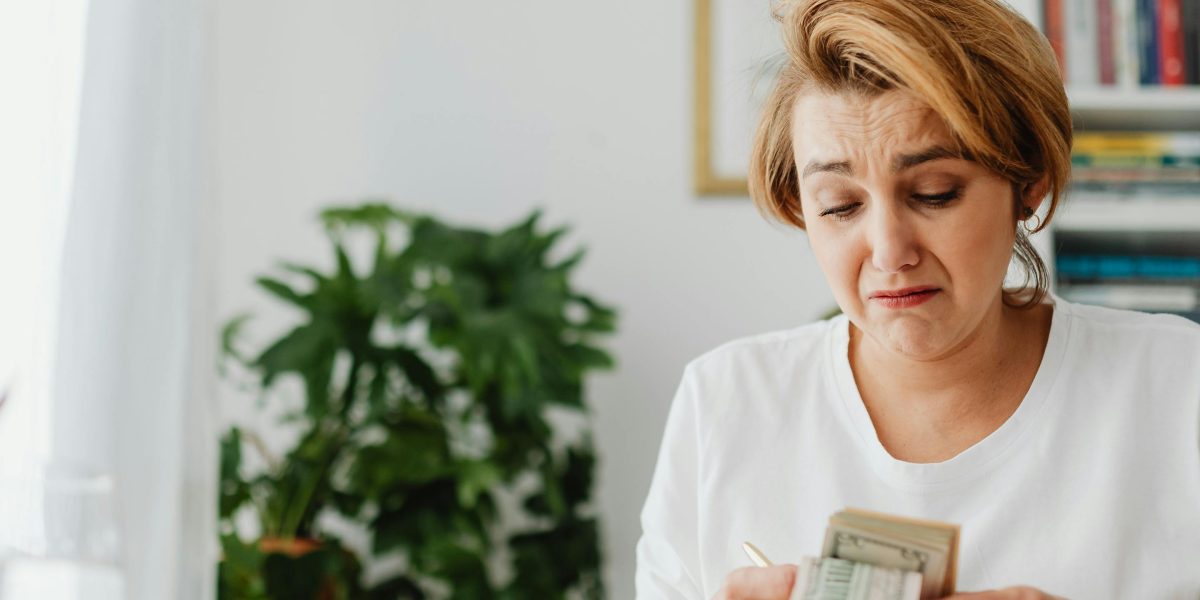 A business person reviews financial documents, representing the careful consideration of long-term costs and potential vendor lock-in.