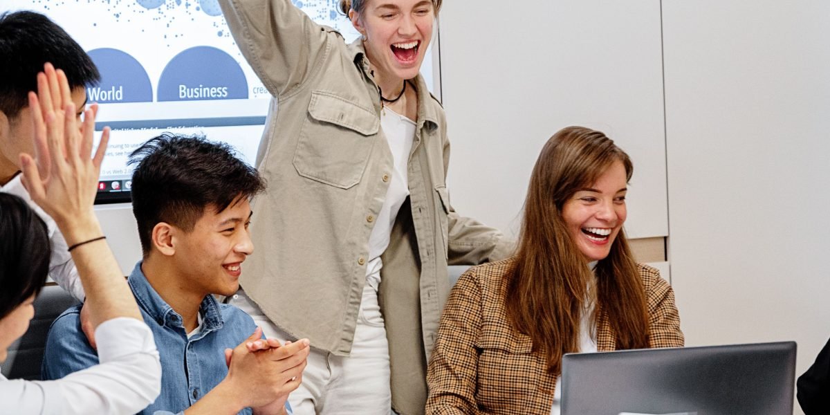 A team celebrates the successful integration and deployment of machine learning models into new products.