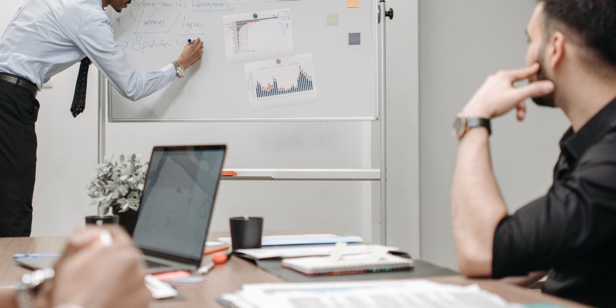 A team actively collaborating, possibly using a dashboard or shared screen, reflecting a streamlined analytics workflow.