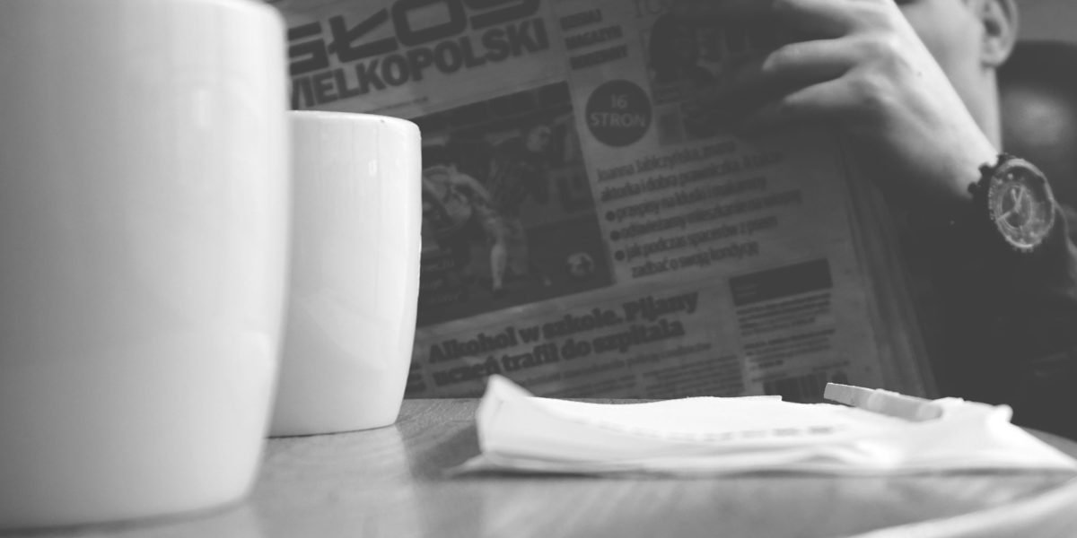 A person stays informed about the latest AI breakthroughs and industry news, reflecting the fast-paced evolution of AI voice technology.