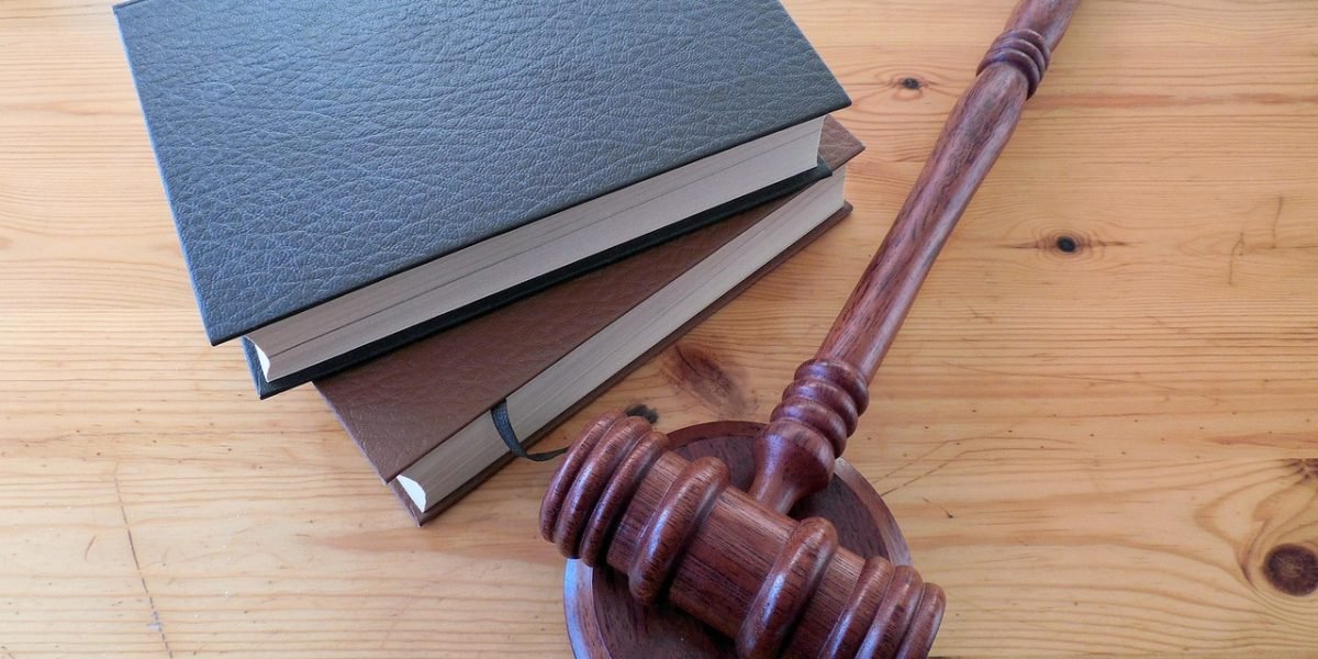 A legal team carefully reviews new regulations to ensure AI system compliance and manage potential risks.