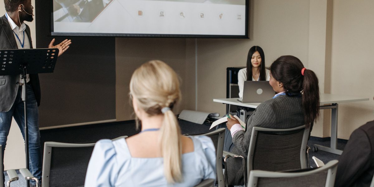 A diverse audience expressing a range of reactions, representing the impact of media content and representation.
