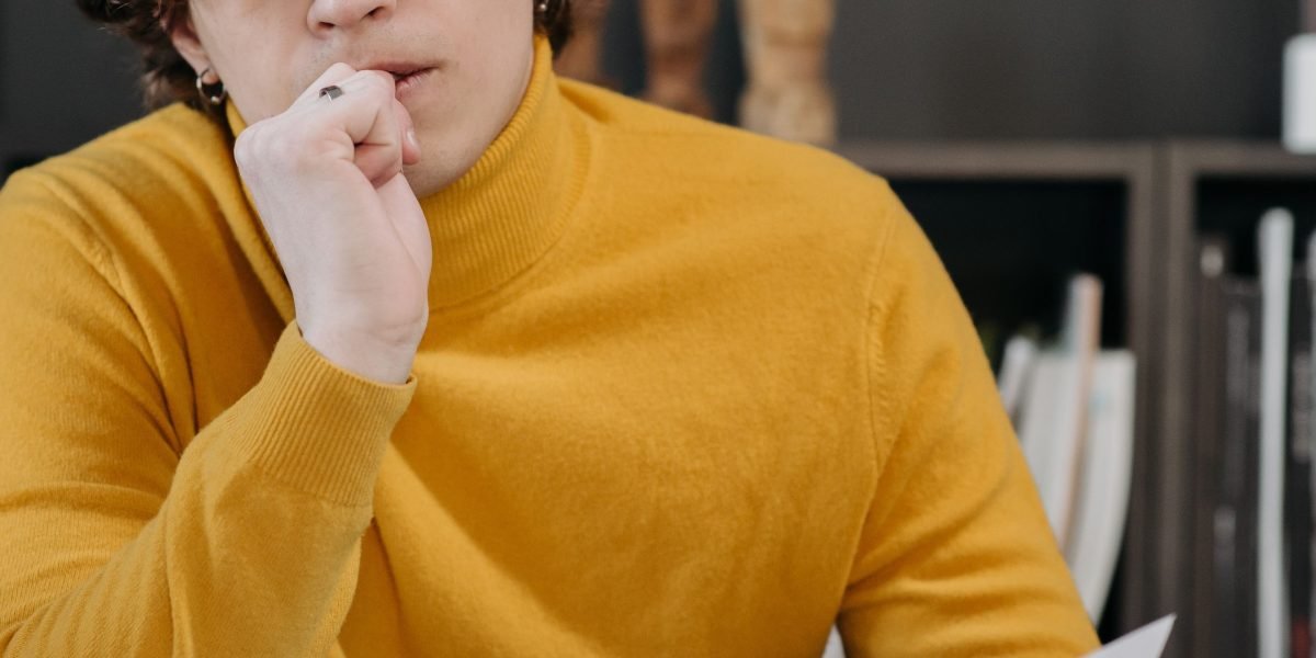A person thoughtfully considering their next career development steps.
