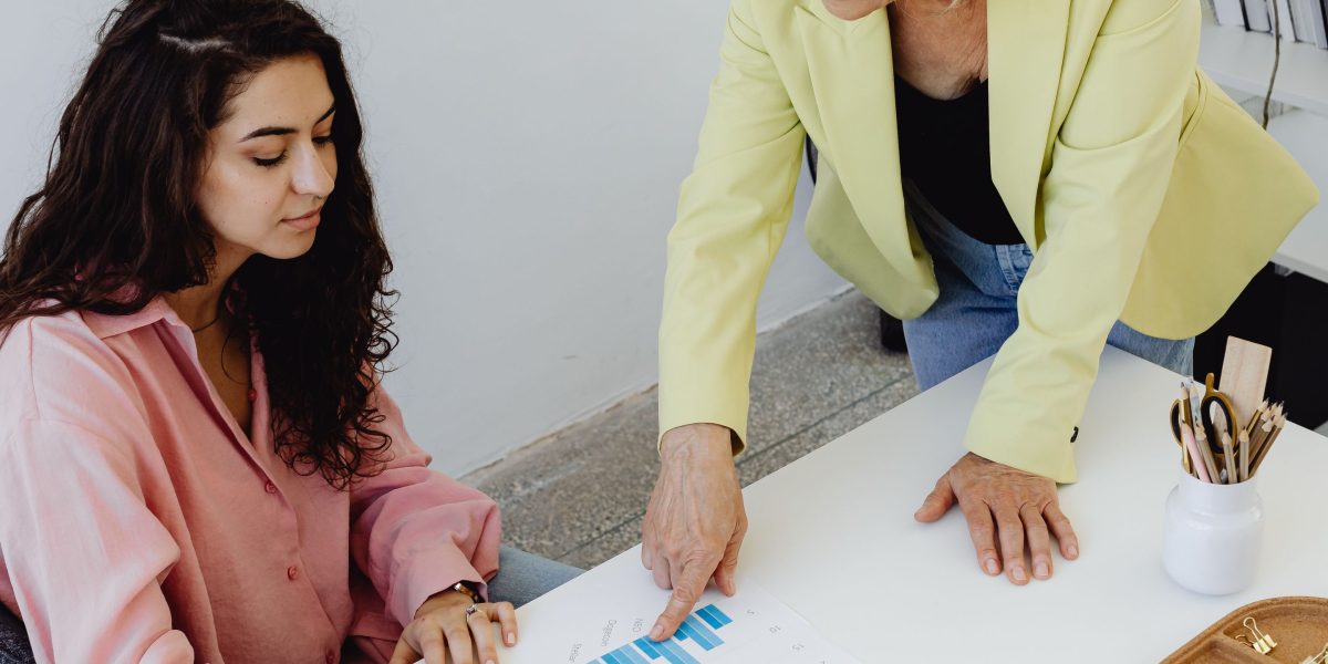 An experienced mentor provides guidance to a young professional, fostering career growth and development.