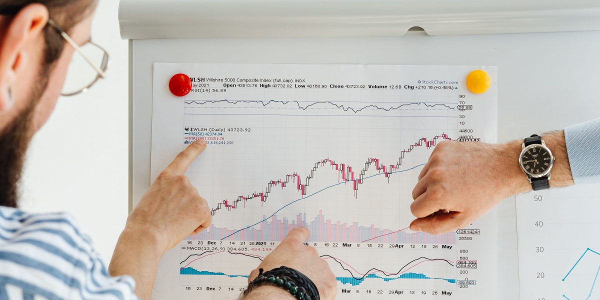 A team collaboratively reviews data and benchmarks to interpret AI model performance results.