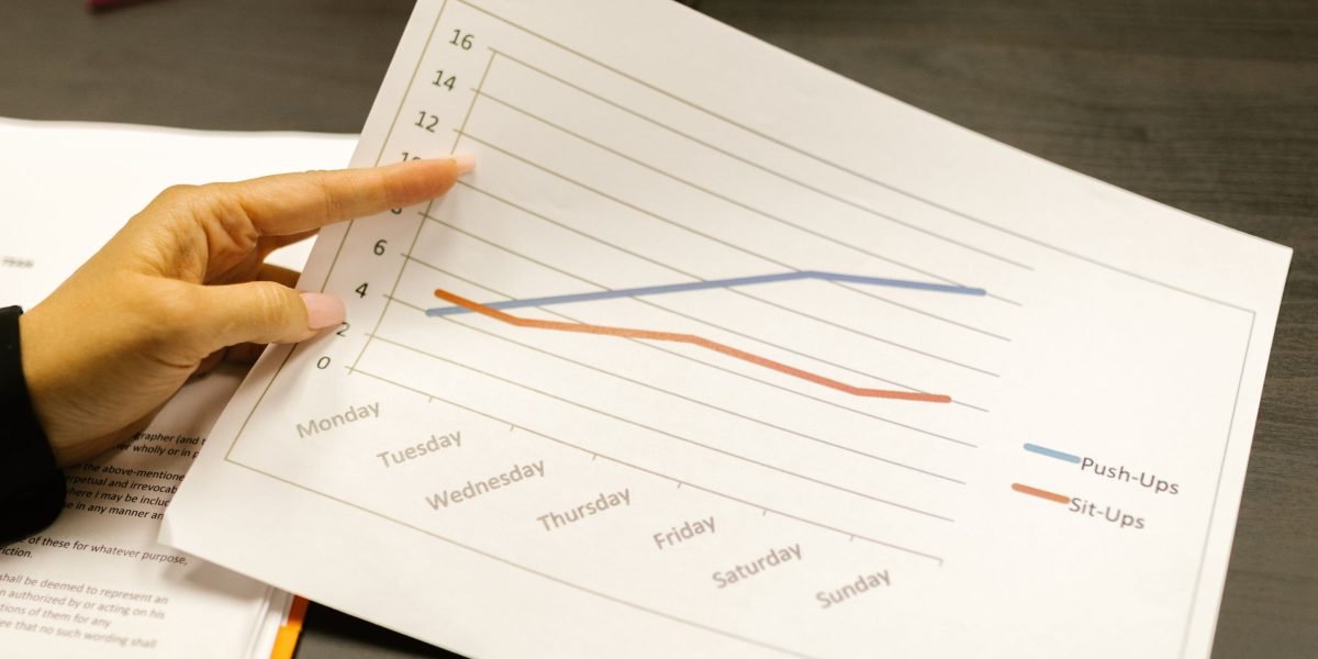 A person reviewing their notes or a plan, emphasizing consistency and thoughtful progress in learning.