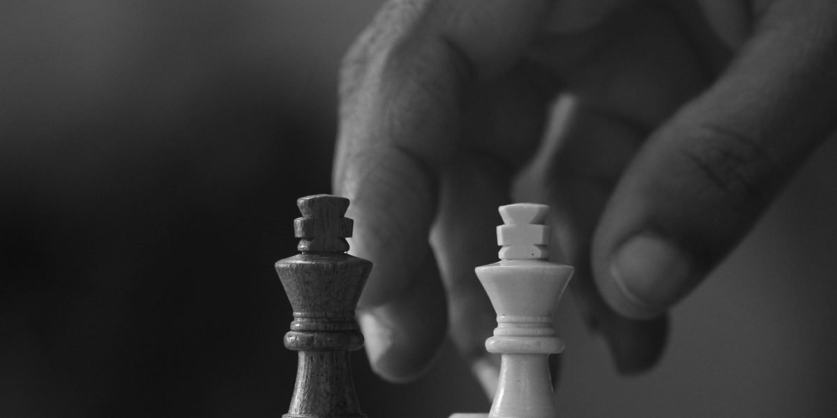 A professional thoughtfully evaluating options, symbolizing the strategic choices leaders face with new technologies.