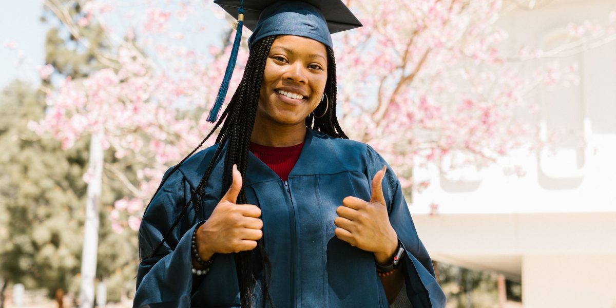 A person celebrating a significant career milestone, such as landing a new job or getting a promotion.