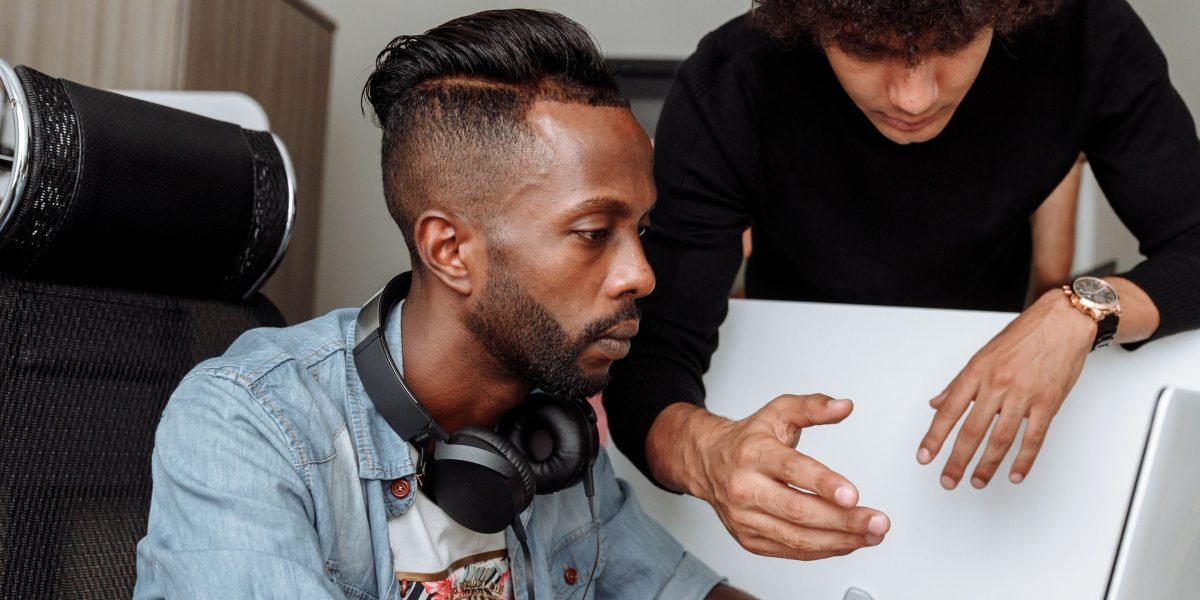 A mentor providing guidance to a young professional, highlighting opportunities in the Swiss AI sector.