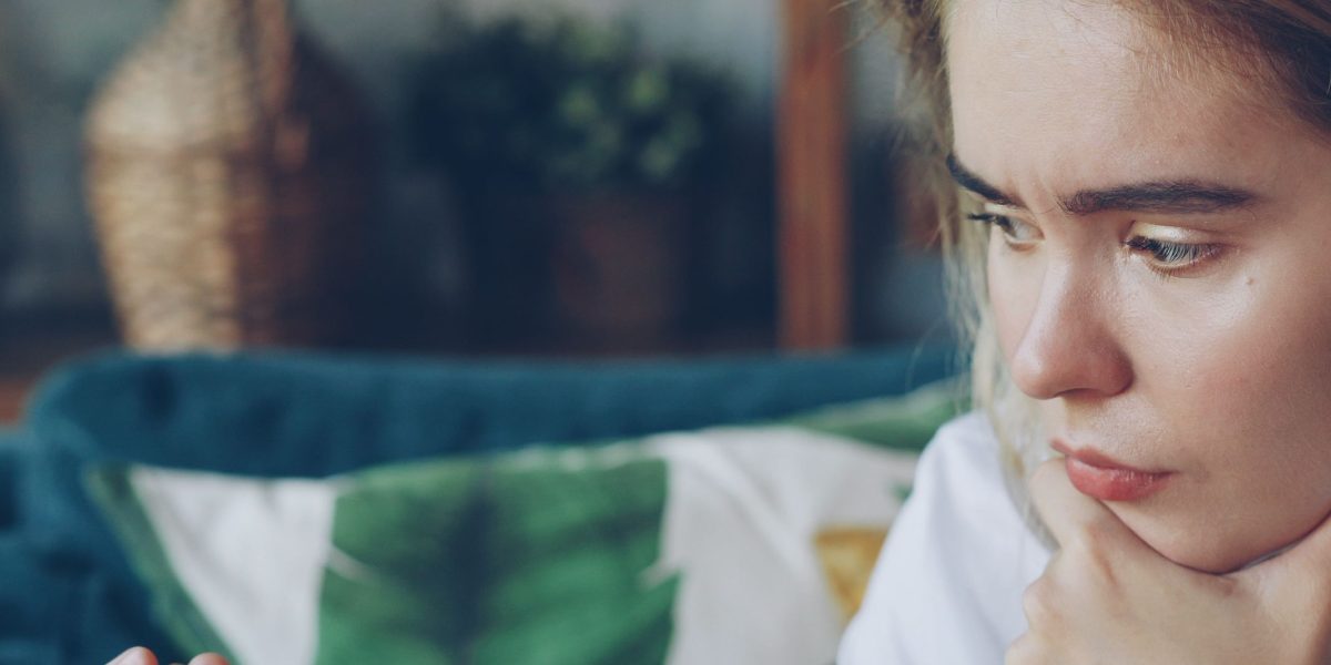 A person thoughtfully considering options, reflecting on career paths and important decisions.