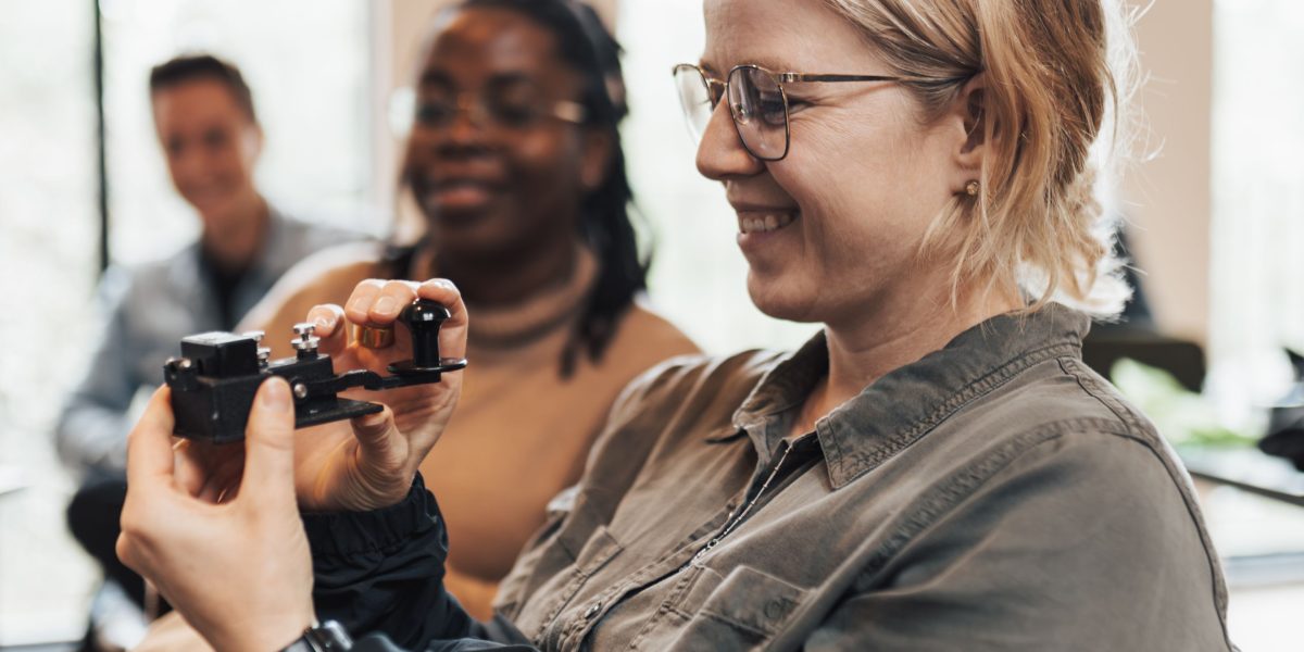 A person deeply engaged in hands-on AI practice, working with data and code to develop practical skills.