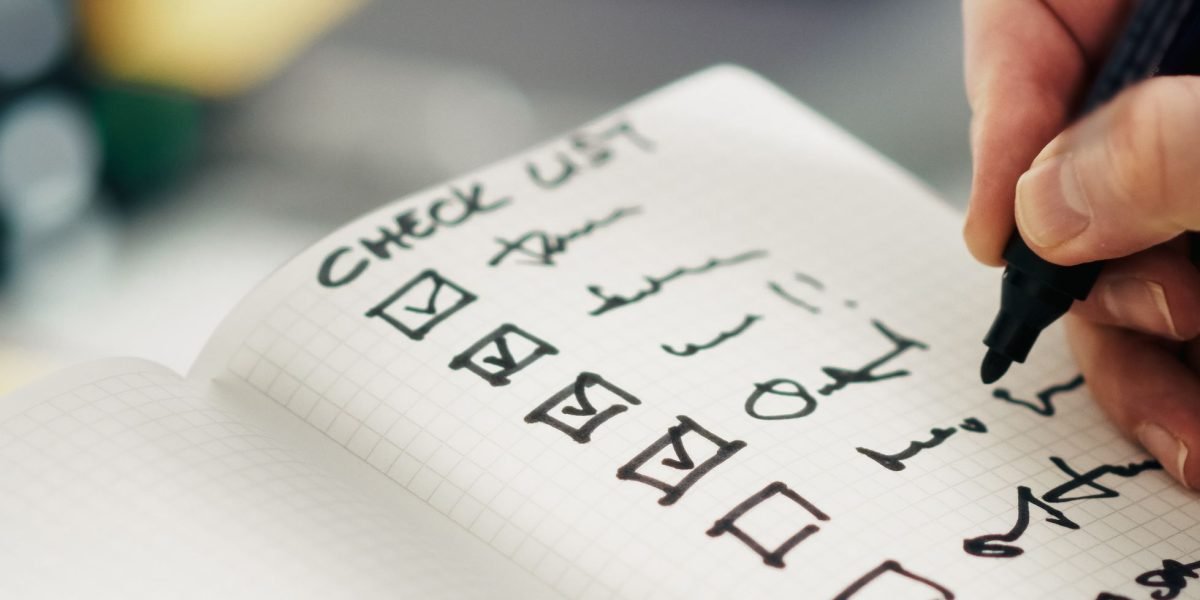An individual meticulously organizes project steps, representing the structured nature of data preprocessing pipelines.