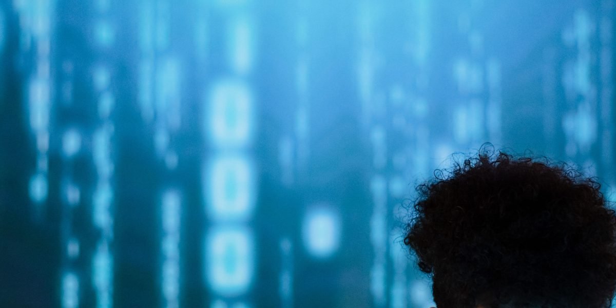 A leader contemplating the complex future and ethical challenges of rapidly evolving AI technology.